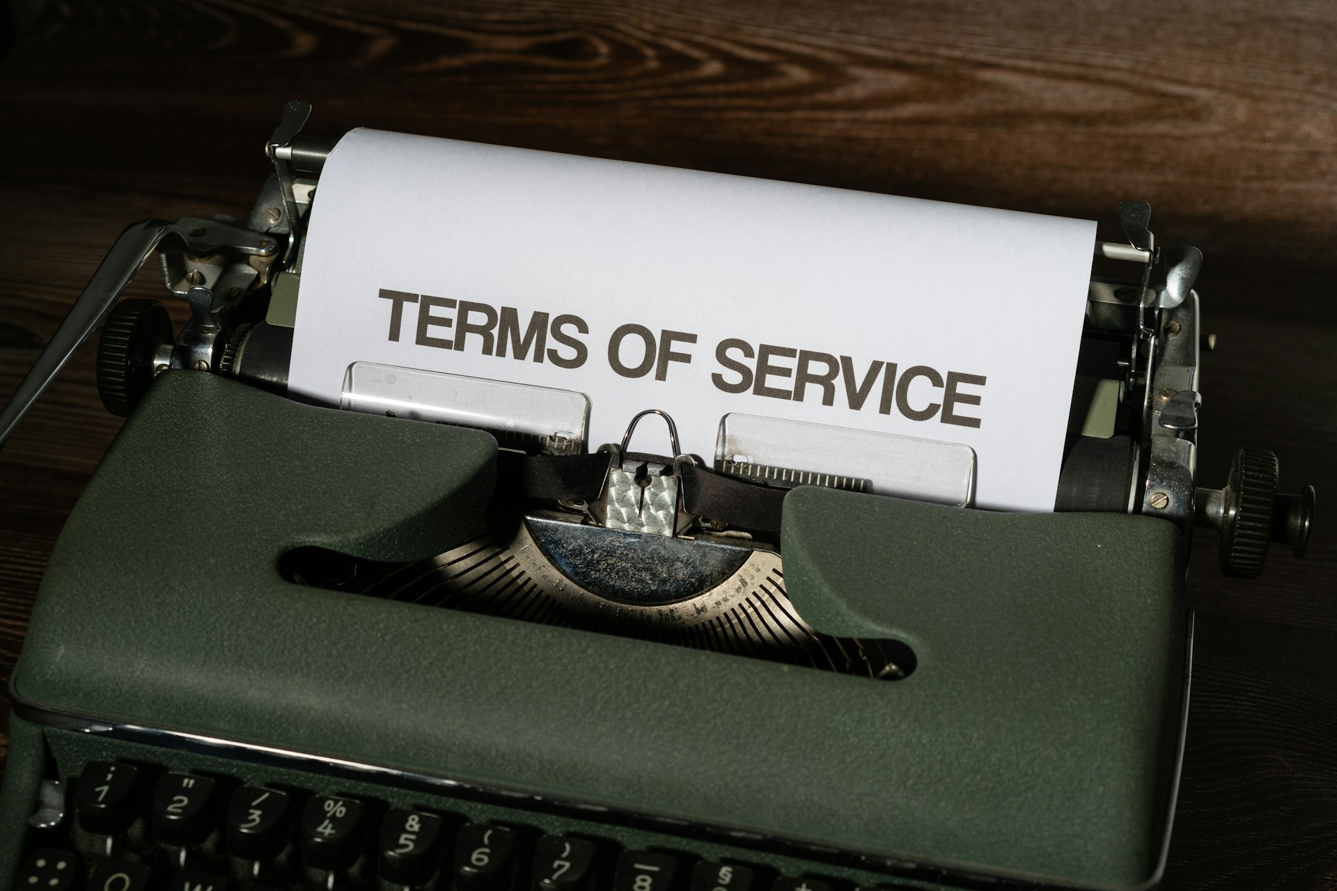 a close up of a typewriter with a paper on it